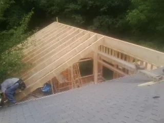 Framing a new roof addition that ties into an existing shingle roof in Garrett